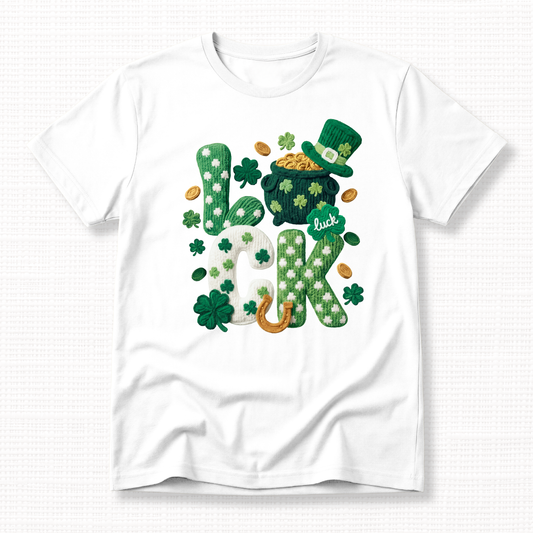 St. Patrick’s Day t-shirt with textured “Lucky” shamrock lettering, pot of gold, leprechaun hat, and horseshoe on a white t-shirt.