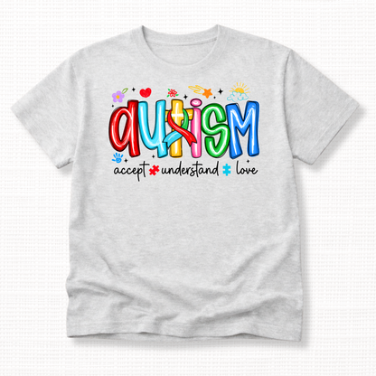 An ash grey shirt with colorful 'Autism' text and words 'Accept, Understand, Love' underneath in white.