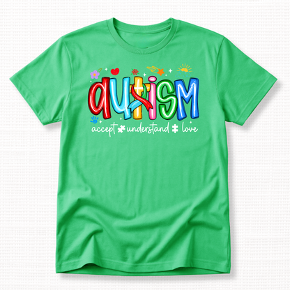 A green shirt with colorful 'Autism' text and words 'Accept, Understand, Love' underneath in white.