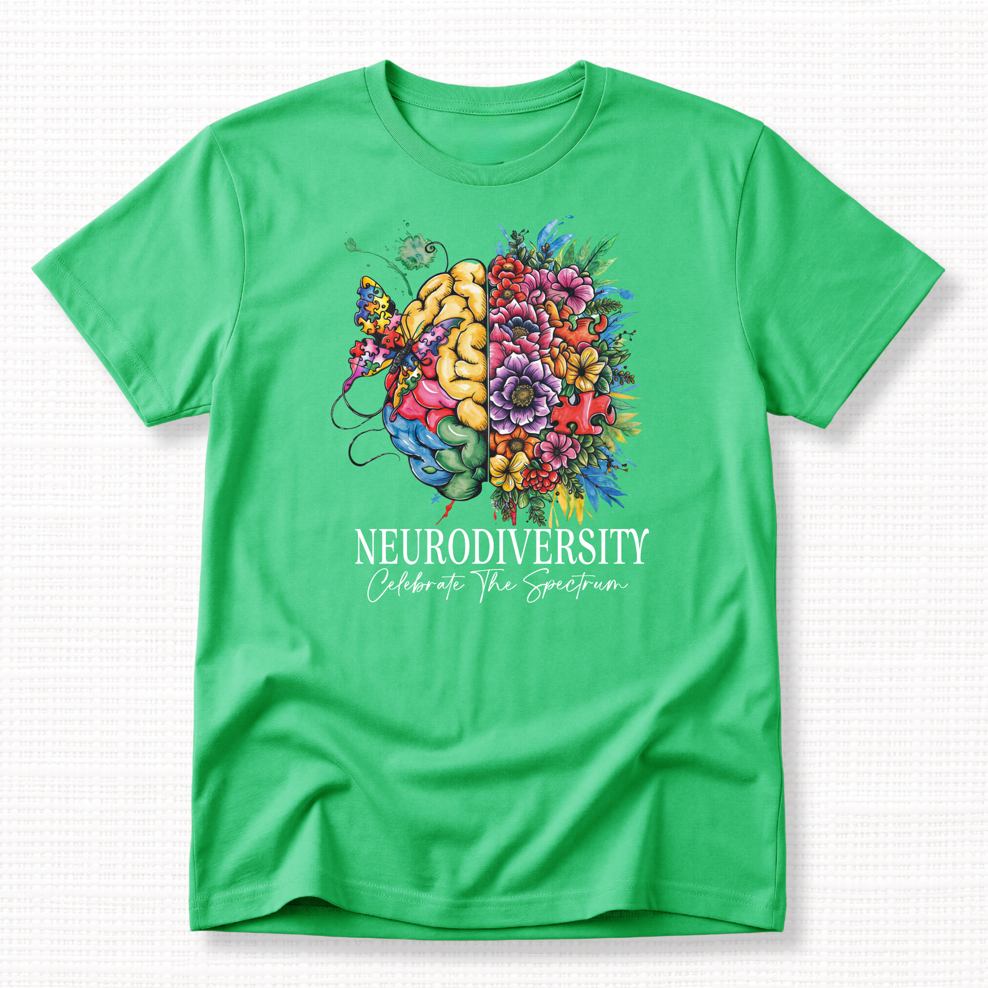 Green t-shirt with a colorful brain and heart design and 'Neurodiversity Celebrate the Spectrum' text in white.