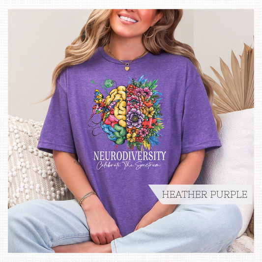 Person wearing a purple t-shirt with a colorful brain design and 'NEURODIVERSITY Celebrate the Spectrum text in white.