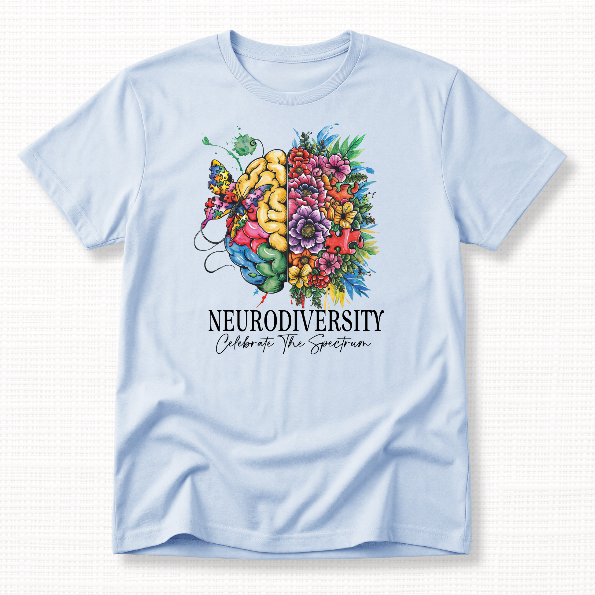 Light blue t-shirt with a colorful brain design and 'Neurodiversity Celebrate The Spectrum' text in white.