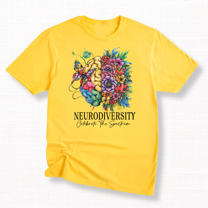 Yellow t-shirt with a colorful design of a brain split into floral and abstract sections with "Neurodiversity, Celebrate the Spectrum" in black text.